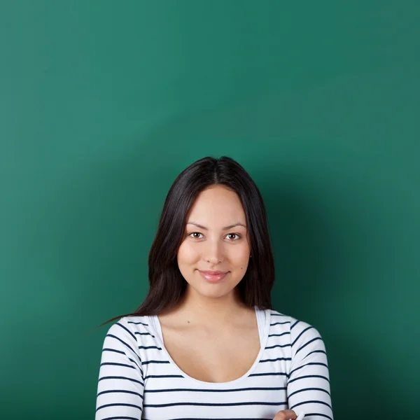 Confident young woman in classroom — Stock Photo, Image