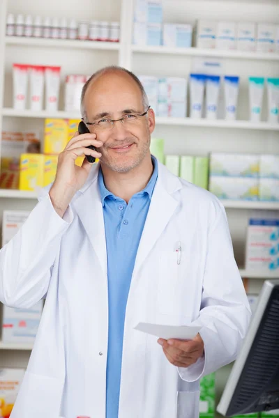 Confident pharmacist calling — Stock Photo, Image