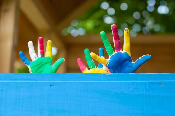 Colorful Children's hands in playhouse — Stock Photo, Image