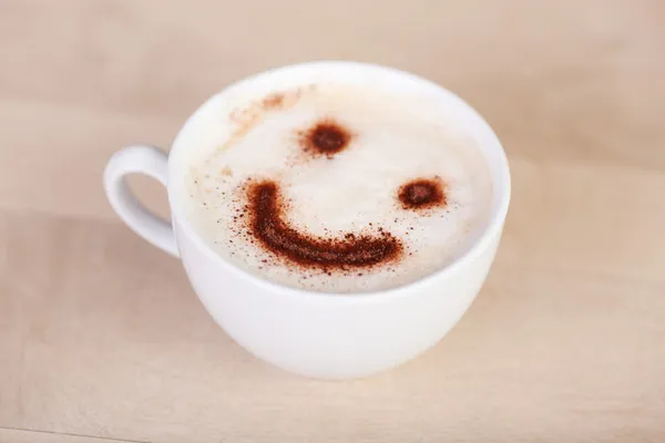 Cup of cappuccino with smiley — Stock Photo, Image