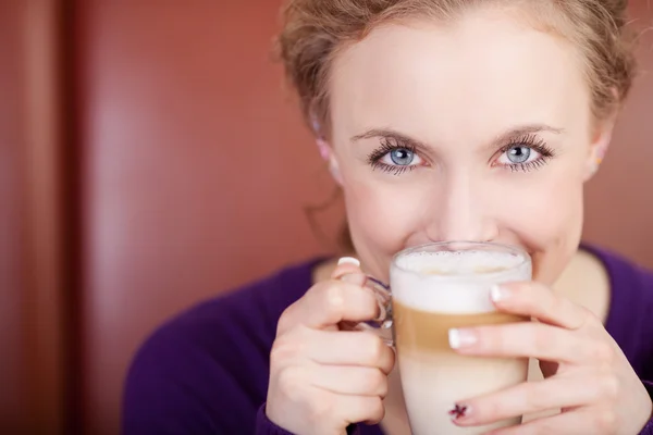 Woman Holding Cafe Latte Cup In Coffee Shop Royalty Free Stock Images