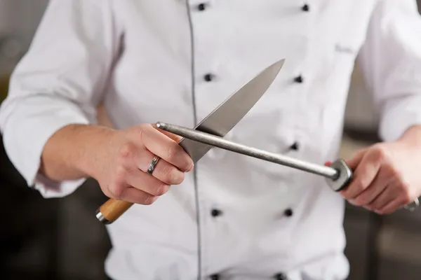 Chef Sharpening Knife In Commercial Kitchen — Stock Photo, Image