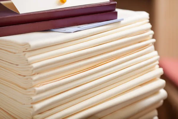 Stacked Tablecloths In Restaurant — Stock Image Stacked Tablecloths In Restaurant Stock Photo