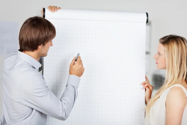 Business presenting at flipchart — Stock Photo, Image