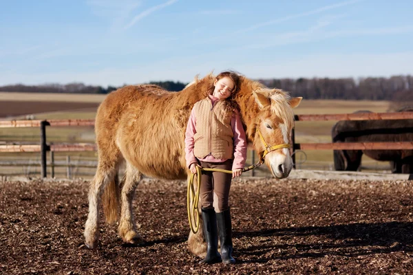 Young happy girl with her horse — Stock Photo, Image