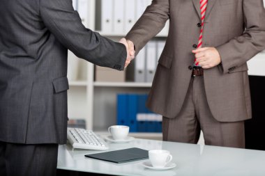 Business partner shaking hands clipart