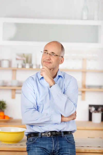 Pensive man in kitchen — Stock Photo, Image