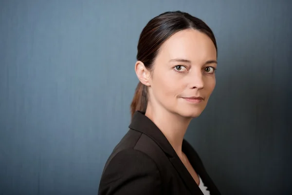 Thoughtful Businesswoman Against Blue Wall — Stock Photo, Image