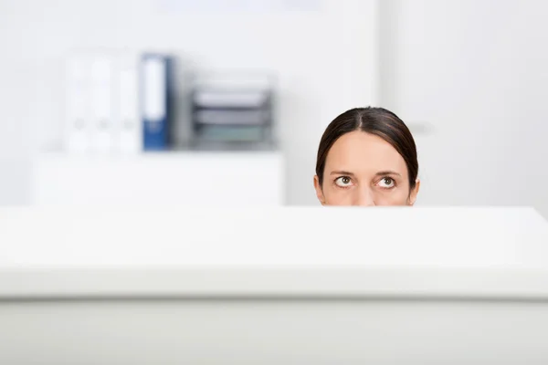 Businesswoman Looking Up In Cubicle — Stock Photo, Image
