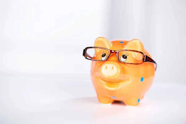 Piggybank With Glasses On Desk — Stock Photo, Image