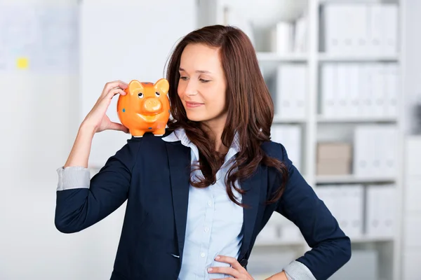 Piggybank on shoulder — Stock Photo, Image