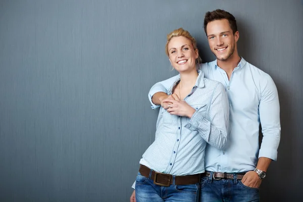 Loving Couple Against Bue Gray Background — Stock Photo, Image