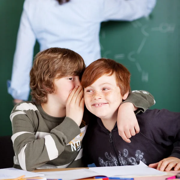 Two young boys sharing secrets — Stock Photo, Image