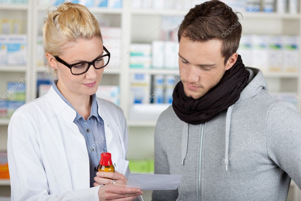 Customer Buying Medicine At The Pharmacy — Stock Photo © racorn 26580545