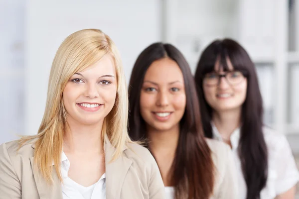 Female trainees standing in the office — Stock Photo, Image