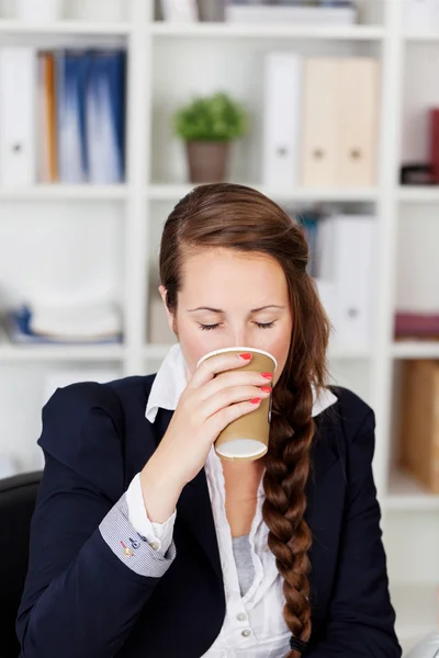 Drinking businesswoman — Stock Photo, Image