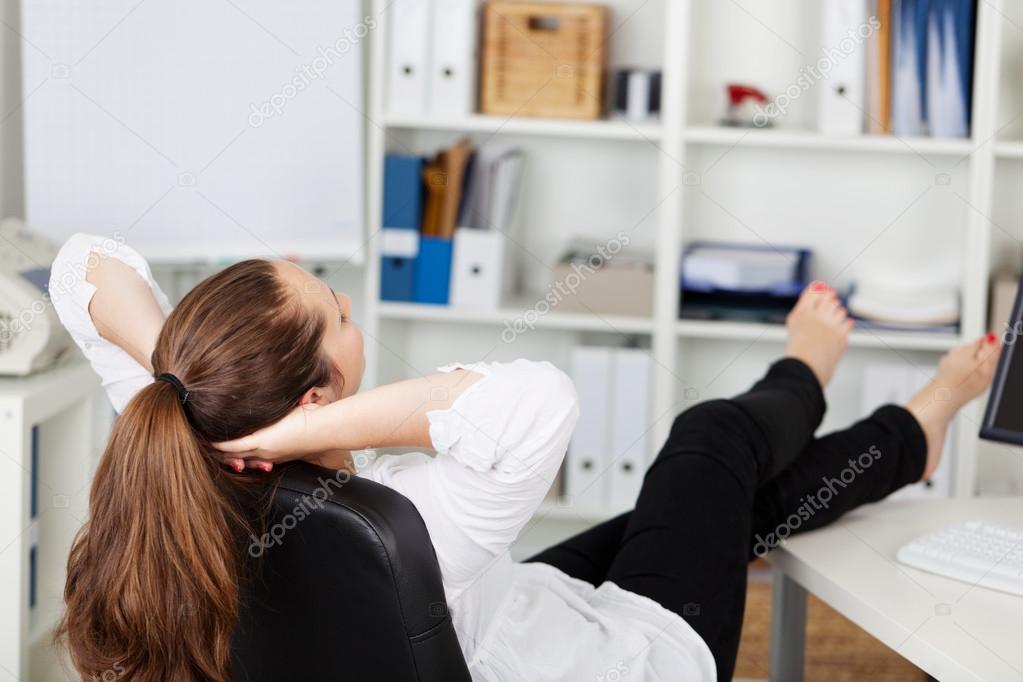Closeup Image Of Businesswoman Resting Feet Under Desk Stock Photo, Picture  and Royalty Free Image. Image 100729228.