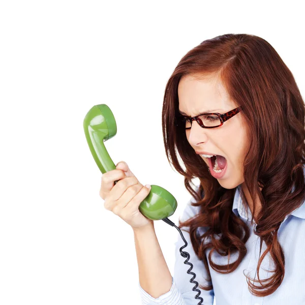 Mujer joven gritando a un teléfono —  Fotos de Stock