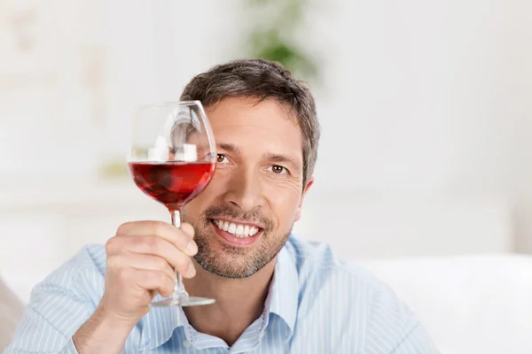 Mature Man Holding Wineglass At Home — Stock Photo, Image