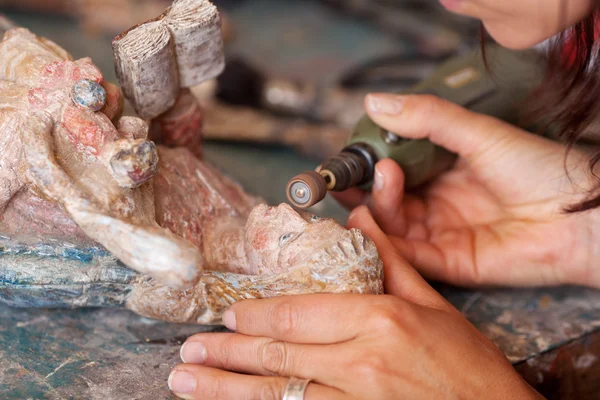 Woman Cleaning Statue With Dremel — Stock Photo, Image