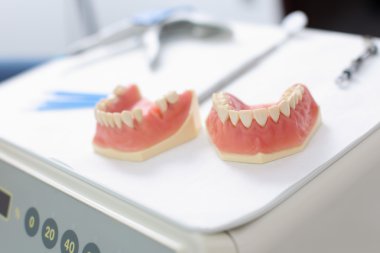 Dentures at dentist clinic clipart