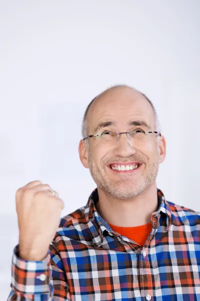 Businessman With Clenched Fist Looking Up In Office — Stock Photo, Image