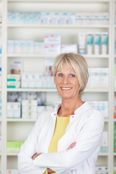 Friendly pharmacist with crossed arms — Stock Photo, Image