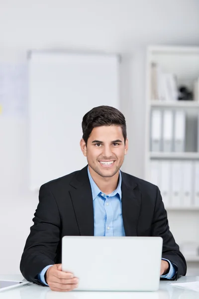 Smiling handsome businessman by the office Stock Photo