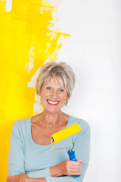 Mature woman and paint job — Stock Photo, Image