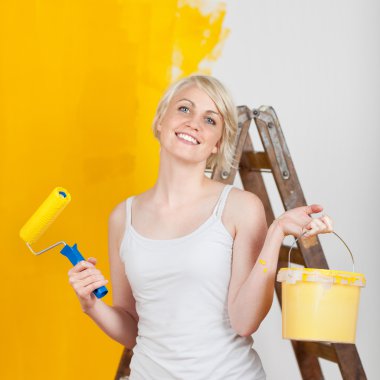 happy woman with paint tools clipart