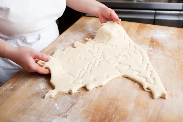 Cookies cut out of rolled pastry — Stock Photo, Image
