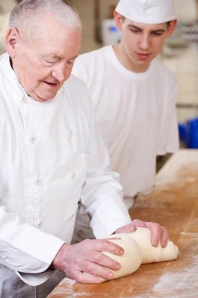 Baker while teaching — Stock Photo, Image