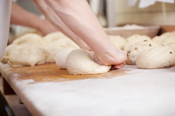 Close-up of baker kneading — Stock Photo, Image