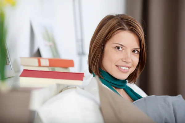 Side profile portrait of a woman in living room — Stock Photo, Image