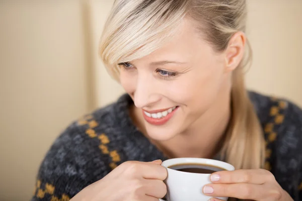 Attractive blond woman enjoying her cup of coffee Stock Image