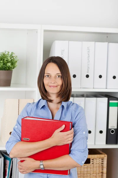 Businesswoman Holding Binder In Office — Stock Photo, Image