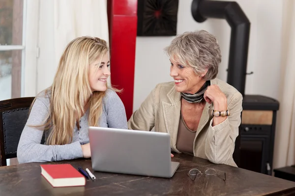 Grandmother and granddaughter working together — Stock Photo, Image