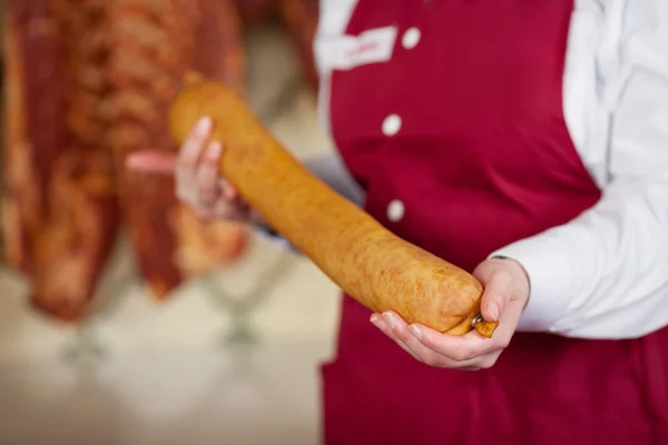 Midsection Of Butcher Holding Sausage — Stock Photo, Image