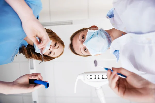 Female Dentists Using Dental Tools In Clinic — Stock Photo, Image