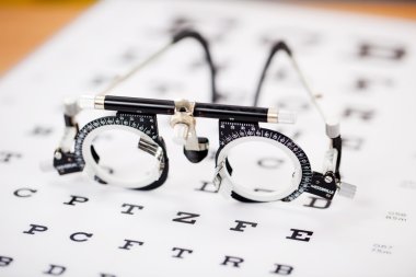 Eye Test Glasses On Snellen Chart clipart