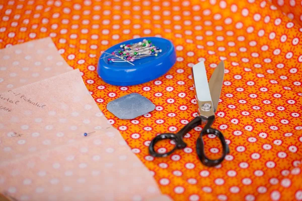 Tailoring Tools On Orange Cloth In Workshop — Stok Foto