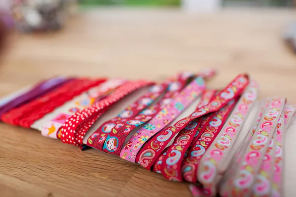 Various Laces Wrapped On Table In Workshop — Stock Photo, Image