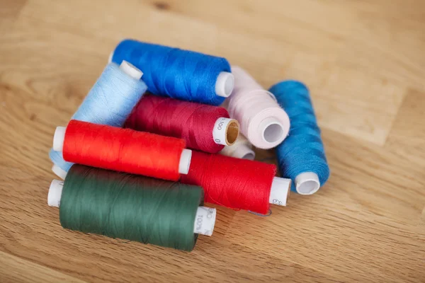 Assorted colourful sewing yarn — Stock Photo, Image