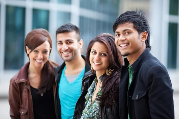 Two couples relaxing in town — Stock Photo, Image