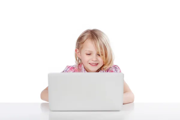 Adorable little girl with a laptop — Stock Photo, Image