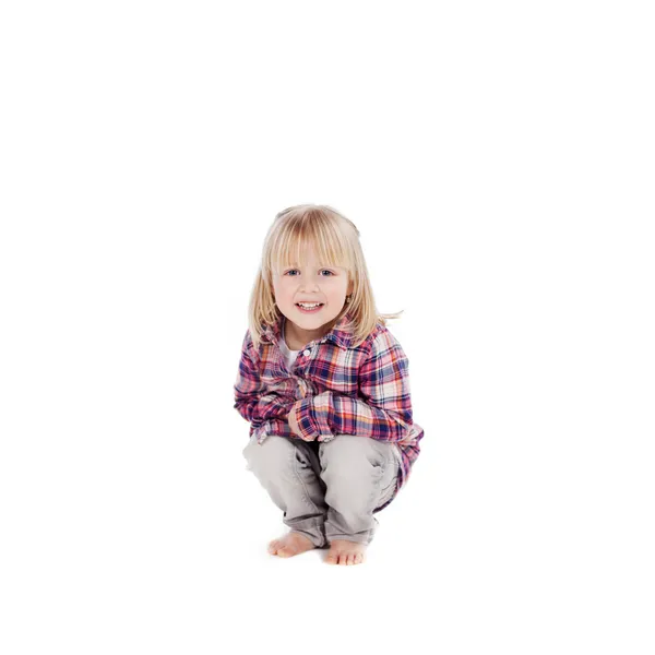 Little girl crouching down — Stock Photo, Image