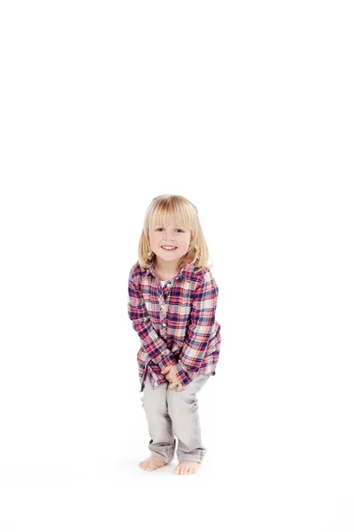 Smiling ittle girl crouching down — Stock Photo, Image