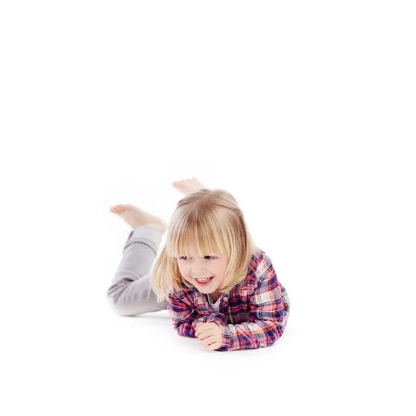 Little girl romping on the floor — Stock Photo, Image