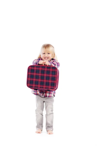 Χαμογελώντας μικρό κορίτσι με τη βαλίτσα — Φωτογραφία Αρχείου
