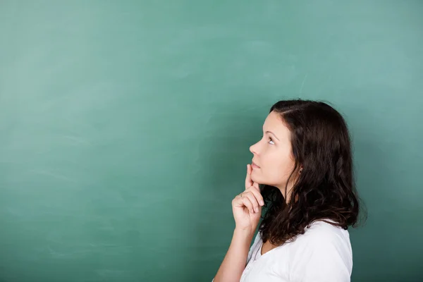 Student standing solving a problem — Stock Photo, Image